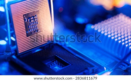 Macro cpu chip and socket close up with vivid blue neon lighting for technology data center background.