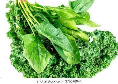 Macro Of Crisp Raw Spinach And Kale Leaves On White