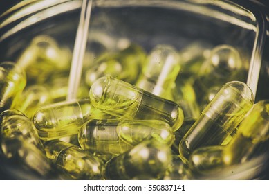 Macro Detail Oannabis Extraction Capsules Infused With CBD Oil In A Jar