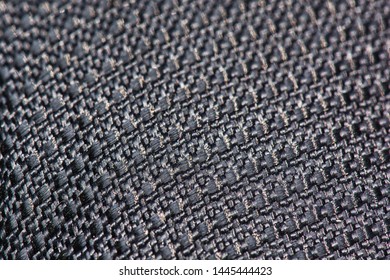 Macro Detailed Rough Textile Texture Background. Dark Monochrome Linen. Grey Fabric Neutral Backdrop For Object Photoshoot, Presentation Or Wallpaper Design. Seamless Grunge Cloth Closeup