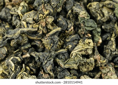 Macro dried tea leaf surface fullframe Tie Guan Yin background