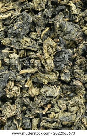 Macro dried tea leaf surface fullframe Tie Guan Yin background