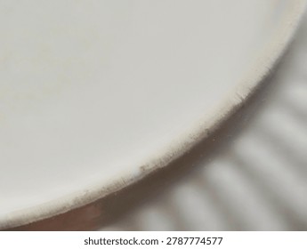 Macro extreme close-up of a rustic ceramic pottery piece, showing intricate ribbed texture and unglazed rim detail.