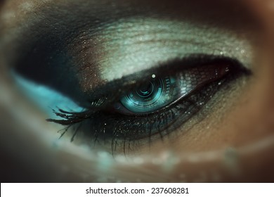 Macro eye of beautiful girl with digital interface inside of pupil - Shutterstock ID 237608281