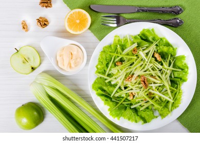 Macro Of Fresh Waldorf Salad With Walnuts, Green Apple And Celery, Authentic Recipe, Half Of A Lemon, And Mayo In A Gravy Boat On Table Mat, View From Above, Close-up 