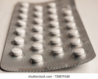 Macro Of Full Packet Foil Of White Tablets Healthcare; Essex; England; Uk