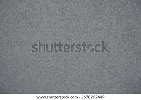 Macro of grey wall with grained roughcast render