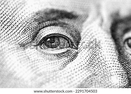 Macro image of Benjamin Franklin on one hundred US Dollar bill. Money of United States. Business and finance concept. Selective focus.