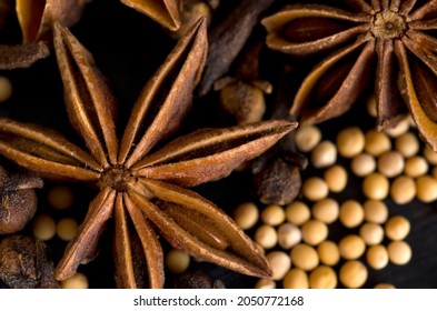 Macro Image of Clove,Star Anise and Mustard Seeds on Black Background Horizontal - Powered by Shutterstock