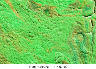 Macro image of a dried paint surface exhibiting complex textural and chromatic patterns formed during solvent evaporation and pigment settling. The background consists of layered strata with visible flow fronts, dendritic branching, and concentric banding—features resulting from Marangoni convection, capillary rise, and differential drying rates. Dominant colors include green, blue, ochre, and brown, distributed in irregular zones separated by thin white margins where binder accumulated. Surface texture varies from smooth glossy areas to granular matte patches, with embedded particles and micro-cracks indicating shrinkage stress. Lighting is even and low-angle, enhancing relief, edge definition, and refractive effects at pigment boundaries without artificial enhancement. No digital filters or compositing were applied. This documentation serves as a source of scientific knowledge for the study of non-equilibrium pattern formation in viscous fluids and colloidal systems. It supports educational materials in physics, materials science, and art technology for visual analysis of self-organization phenomena. Used in university-level courses for the study of fluid dynamics, phase separation, and surface morphology development. Such imagery aids in understanding the dynamics of the living world of Earth through analogies with geological layering, sediment deposition, and mineral precipitation processes. Through precise observation and imaging, this work reinforces empirical methods in interdisciplinary research and encourages deeper engagement with the physical principles underlying aesthetic forms. The image reflects principles of documenting natural outcomes of physical laws, supporting public education about pattern formation and the intersection of science and abstract expression