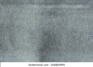 Macro image of grey CMYK dots on newsprint