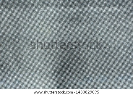 Macro image of grey CMYK dots on newsprint