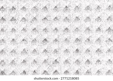 Macro image of a halftone dot pattern forming rows of small black triangles printed on white paper with uniform spacing.