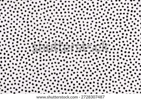 Macro image of a halftone dot pattern printed in black ink on white paper, featuring uneven dot shapes and varied spacing.