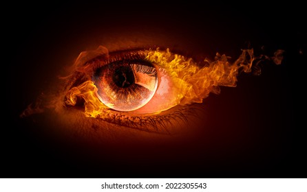 Macro image of human eye with fire flames . Mixed media - Shutterstock ID 2022305543