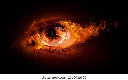 Macro image of human eye with fire flames - Shutterstock ID 2360416971