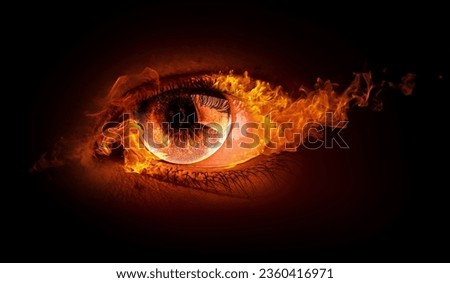 Macro image of human eye with fire flames