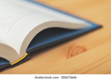 Macro image of an open book on a desk