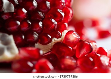 Macro image of red ripe pomegranate, shallow depth of field. Summer fruits background - Powered by Shutterstock