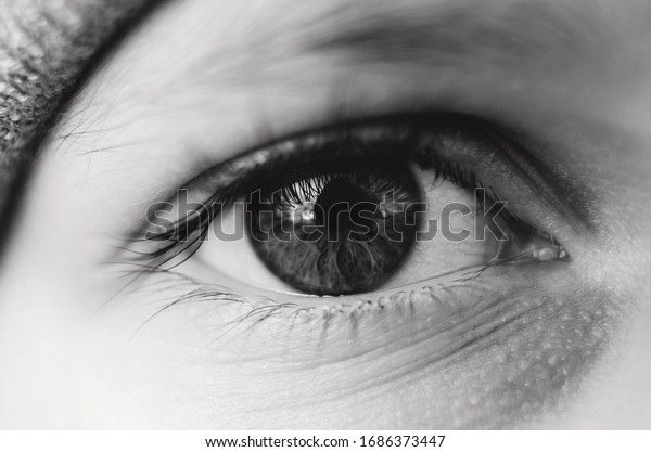 Macro kid\'s eye. Black\
and white photo
