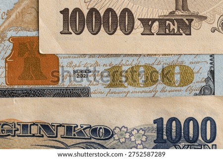 Macro Layered Composition of US Hundred Dollar Bill and Japanese Yen Banknotes