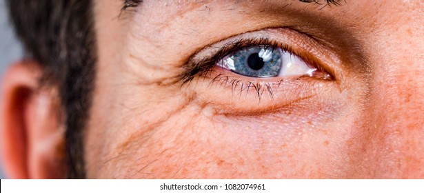 macro of a man's eye  in his 50s