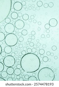 Macro microscope green bubble texture, Close-up Green bubbles and drops oil background . blue green water bubbles, close up golden oil drop for cosmetic	