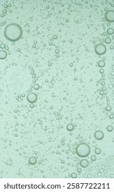 Macro microscope green bubble texture, Close-up Green bubbles and drops oil background . blue green water bubbles, close up golden oil drop for cosmetic	