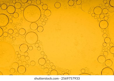 Macro microscope yellow bubble texture, Close-up Yellow bubbles and drops oil background . golden Yellow water bubbles, close up golden oil drop for celebration 