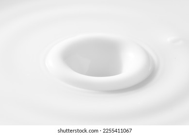 macro milk texture,drop falling on milk or white liquid and created splash with circle ripple,White Color,Falling,Milk,Vertical,White Background,Shampoo, - Shutterstock ID 2255411067