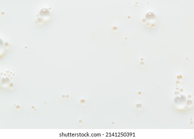 Macro milk texture,White surface of milk and bubbles and ripples from above birds eye view 