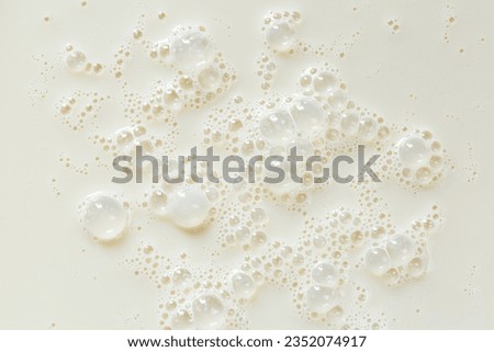 macro milk texture,White surface of milk and bubbles and ripples from above birds eye view