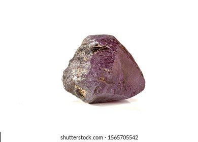 macro mineral stone alexandrite red - violet in daylight on a white background close-up