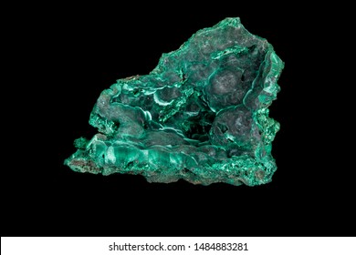 Macro of a mineral stone Malachite on a black background close up