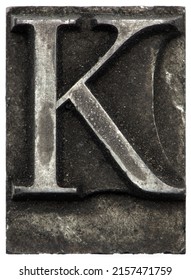 macro old retro vintage typeset letterpress close up of capitol letter K lead letter print shop against white background