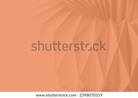 Macro Peach Fuzz color of paper folded in geometric shapes, three-dimensional effect, abstract background. Out of focus. Trendy color 2024 Peach Fuzz