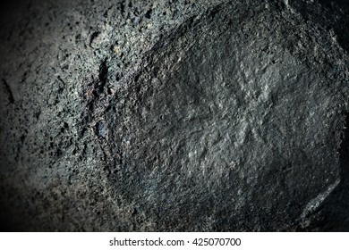 Macro Photo Of A Black Volcanic Rock (bomb). Etna Volcano, Sicily, Italy