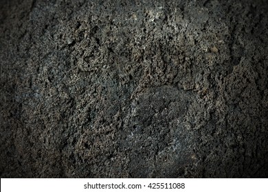 Macro Photo Of A Black Volcanic Rock (bomb). Etna Volcano, Sicily, Italy