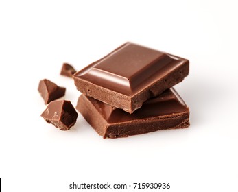 Macro photo  of Chocolate bar. Broken pieces over white background - Shutterstock ID 715930936