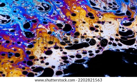 Macro photo of colourful, bright patterns of a soap bubble