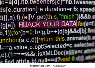 Macro photo of computer screen with program source code and highlighted HIJACK YOUR DATA inscription in the middle. Script on the screen with virus in it. Cyber security concept. Technology background