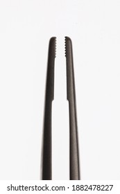 macro photo of dental needle holder on white background - Shutterstock ID 1882478227