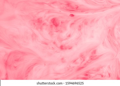 A Macro Photo Of Drops Of Red Food Dye Swirled And Mixed Into Thick Creamy White Milk To Give A Marbled Milkshake Effect