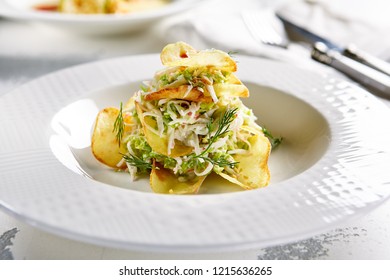 Macro Photo Of Exquisite Serving Salad With Crispy Potato Chips And Chopped Strips Vegetables On Blurred Background. Restaurant Starter Menu Of Veggie Salat With Thin Sliced Fried Potatoes Close Up