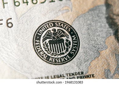 macro photo of federal reserve system symbol on hundred dollar bill. shallow focus. close-up with fine and sharp texture
