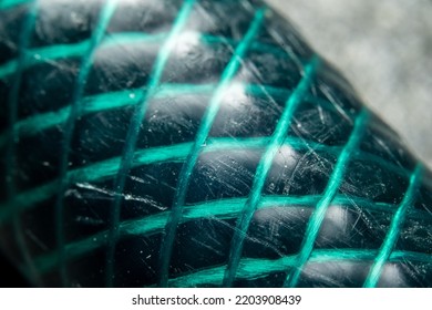 Macro Photo Of A Green Garden Hose.