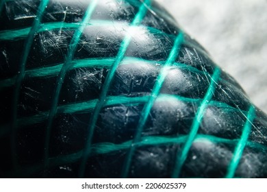 Macro Photo Of A Green Garden Hose.