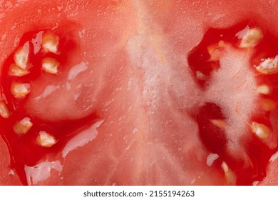 Macro Photo Of Half Cut Tomato Slice With Seeds. Tomato Slice Texture. 