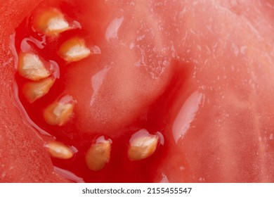 Macro Photo Of Half Cut Tomato Slice With Seeds. Tomato Slice Texture. 