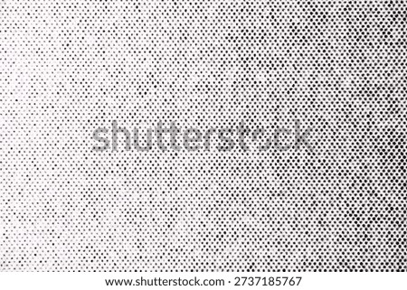 Macro photo of a halftone dot pattern with gradual density shift from light to dark, printed in black ink on white paper.